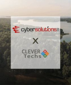 Cyber Solutions and Clever Techs logos over a scenic aerial view of a lake and forest in Anderson, SC, symbolizing their merger to enhance IT and cybersecurity services with a continued local focus.